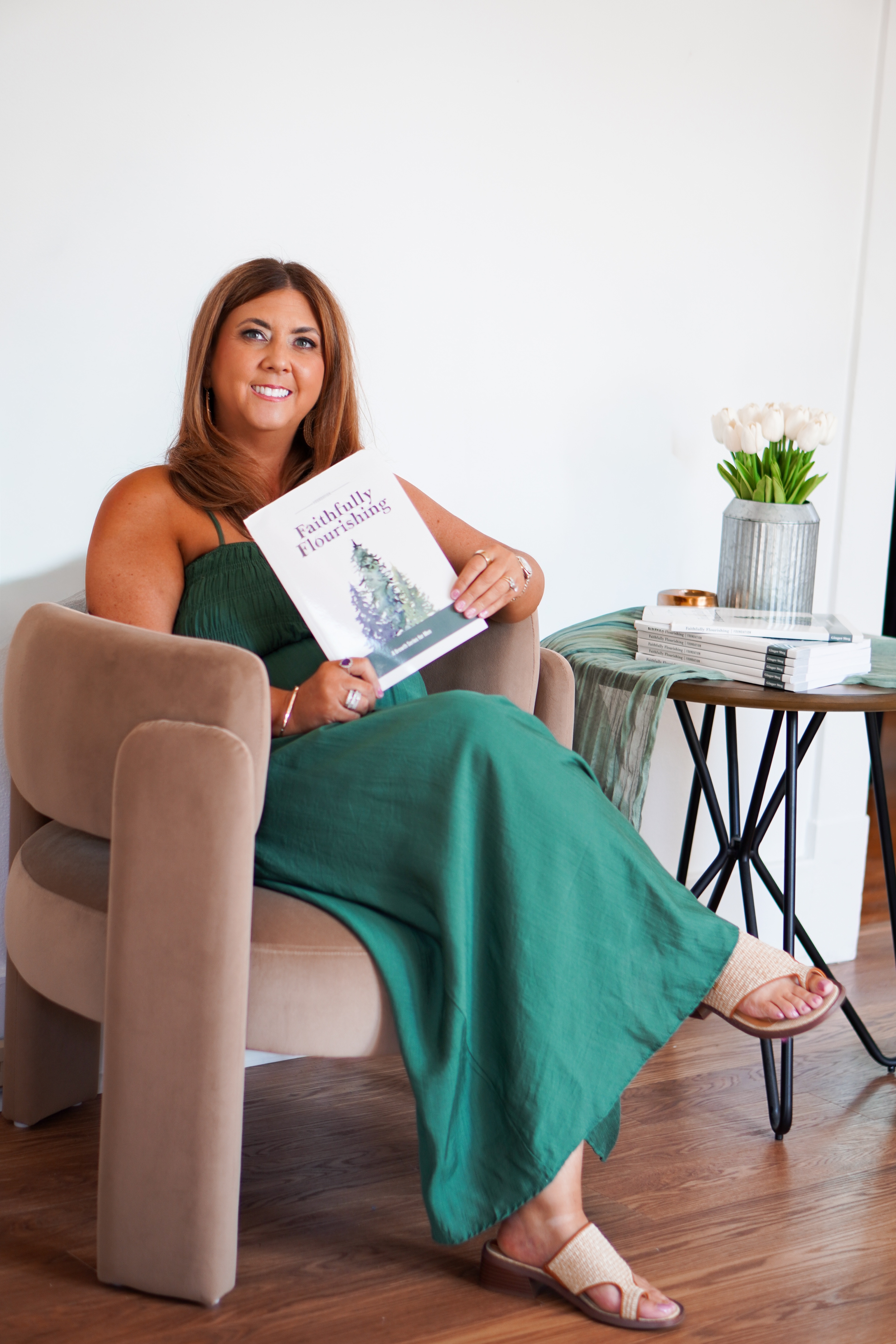 Ginger Steg holding her Faithfully Flourishing book